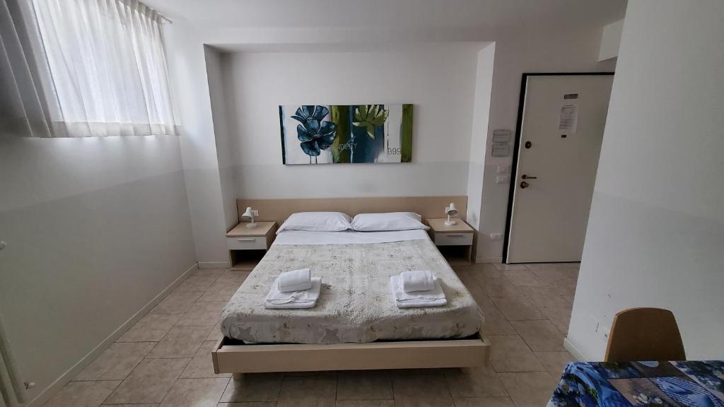 Postel nebo postele na pokoji v ubytování HB Bonomelli 15
