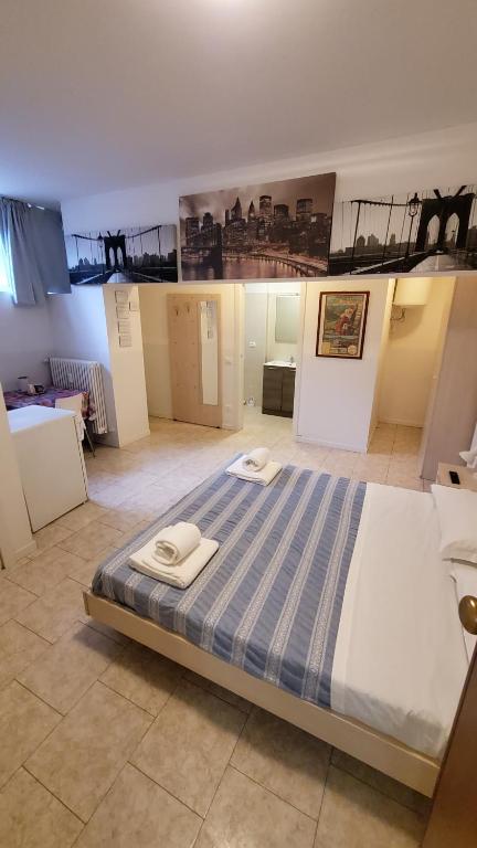 Postel nebo postele na pokoji v ubytování HB Bonomelli 15