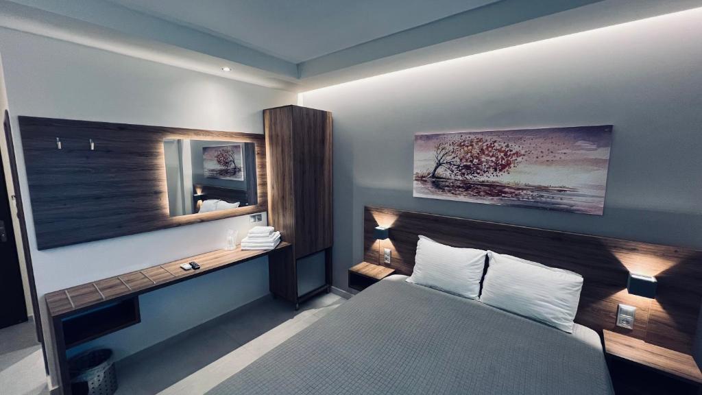 Postel nebo postele na pokoji v ubytování Sunset Hotel