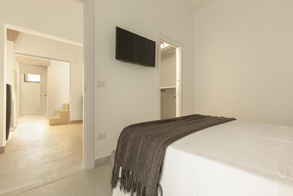 Televízia a/alebo spoločenská miestnosť v ubytovaní Bastioni Luxury Home by Perle di Puglia