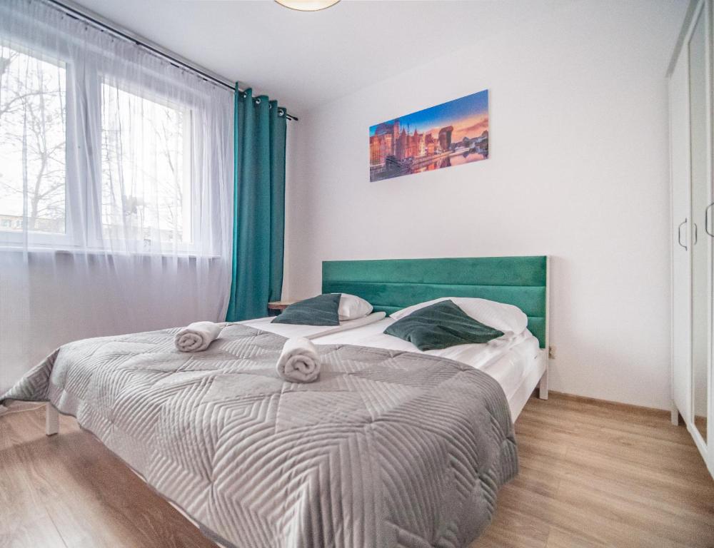 Posteľ alebo postele v izbe v ubytovaní Apartament Dworska
