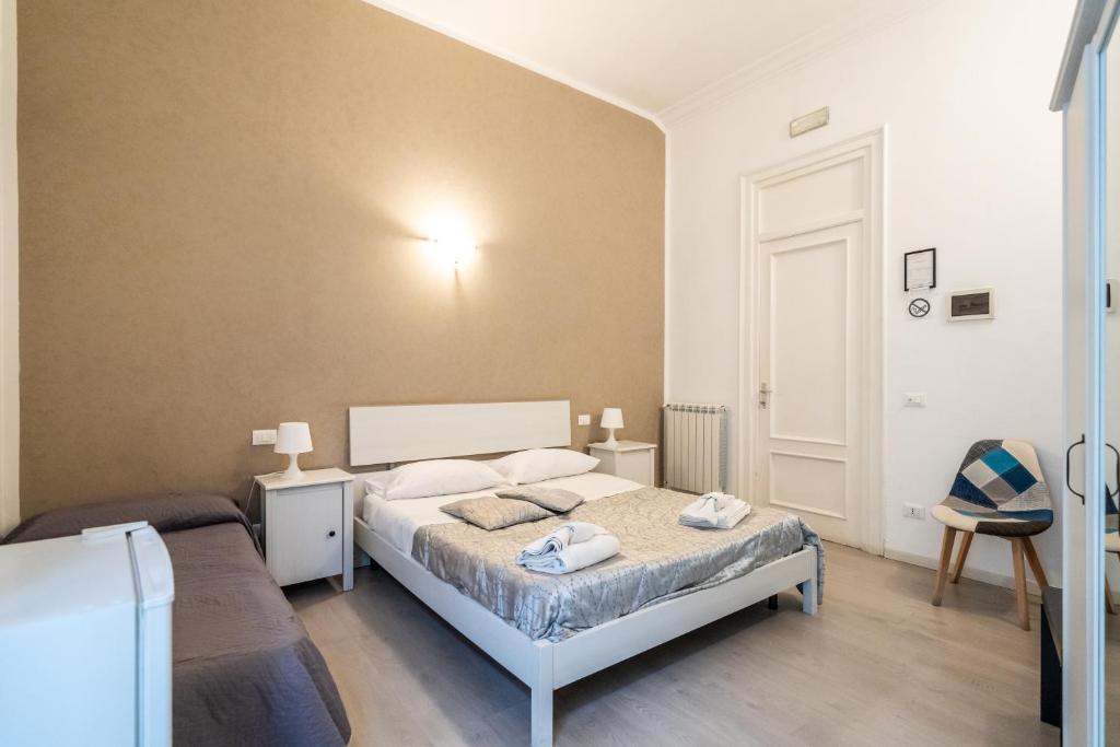 A bed or beds in a room at B&b Glamour