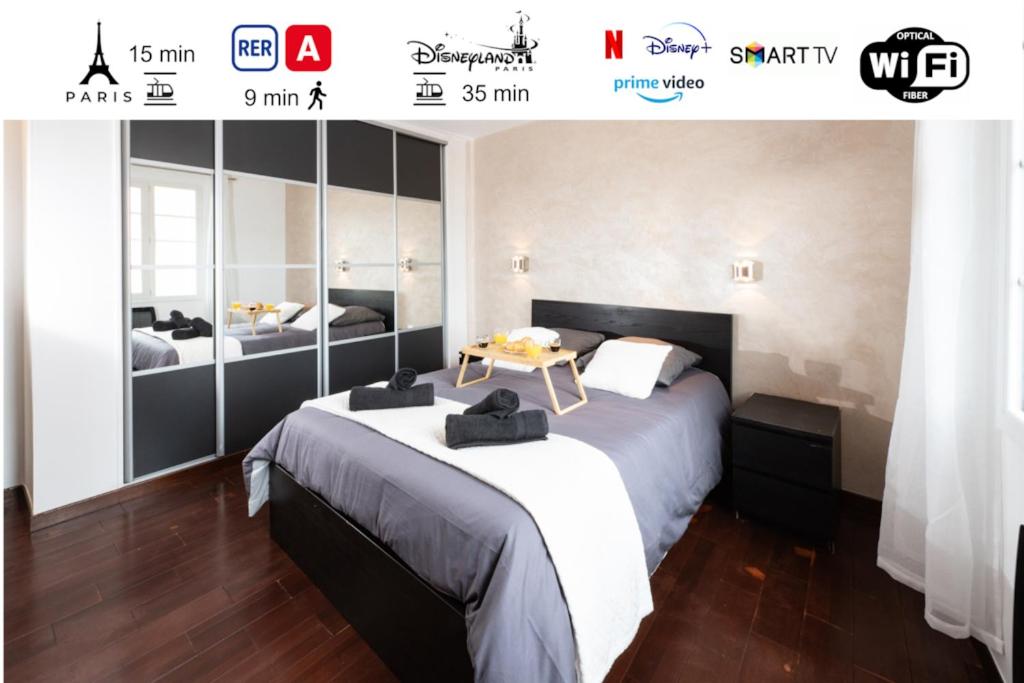 a bedroom with two beds and a table at Cosy Paris - Disneyland - RER A in Fontenay-sous-Bois