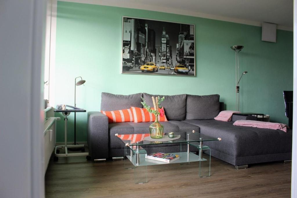 a living room with a couch and a table at Apartment KY481 im PanoramicHohegeiß in Braunlage