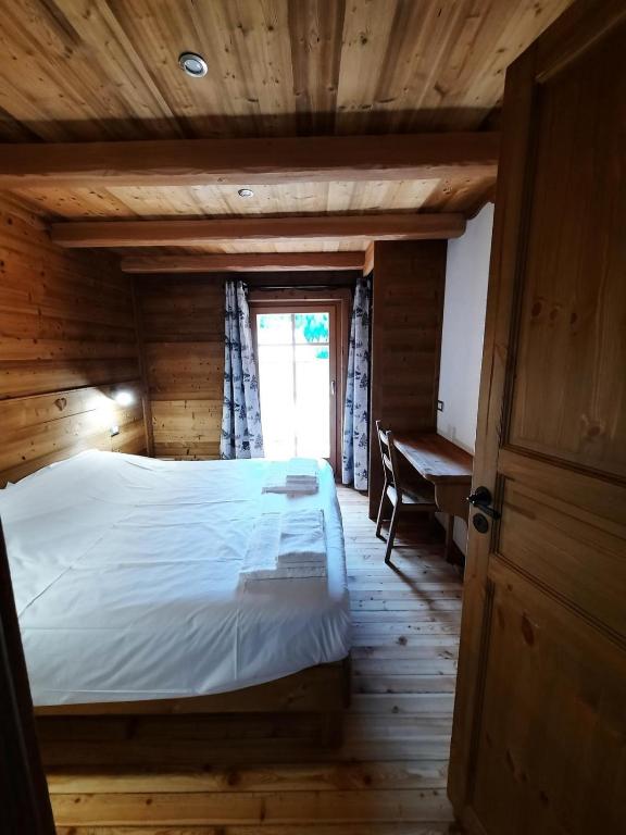 Postel nebo postele na pokoji v ubytování Chalet du Paradis