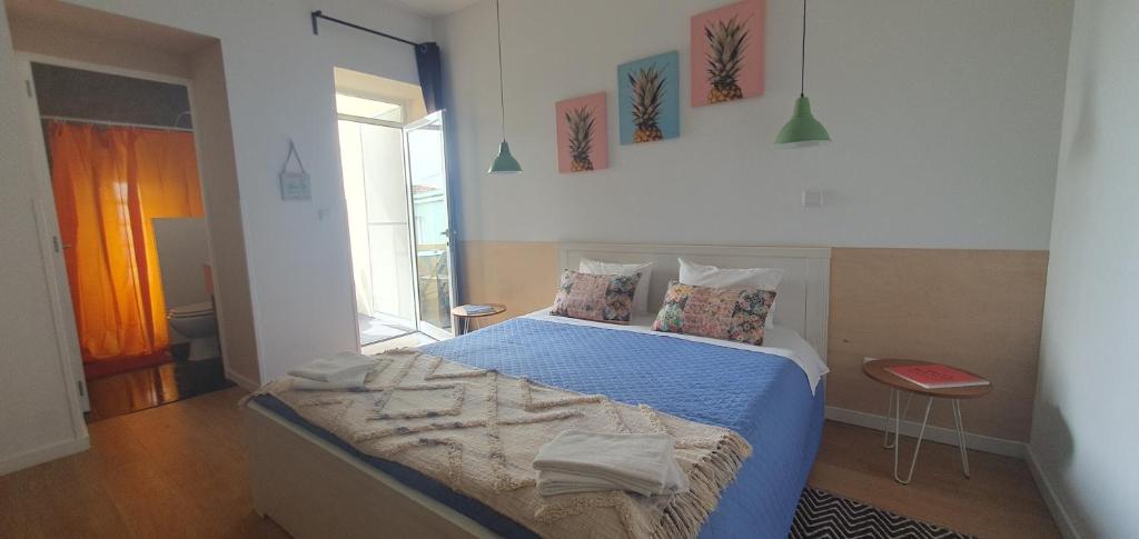 Postel nebo postele na pokoji v ubytování A-Típica GuestHouse