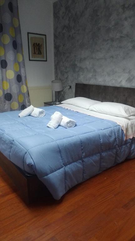 Кровать или кровати в номере BELLAFIORE