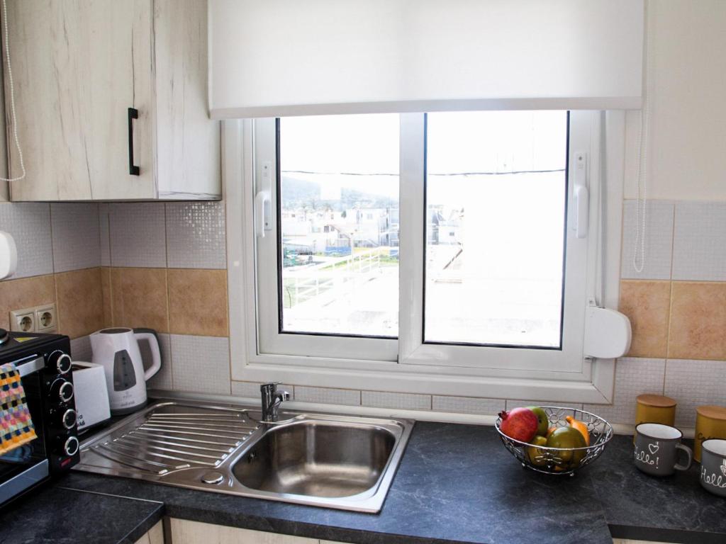 Kuchyň nebo kuchyňský kout v ubytování SunView Studio