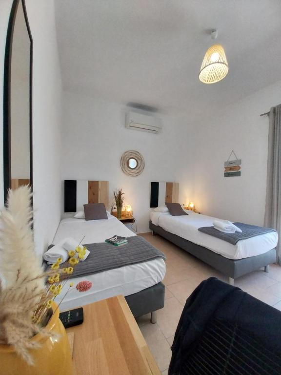 Postel nebo postele na pokoji v ubytování Hôtel Padolo