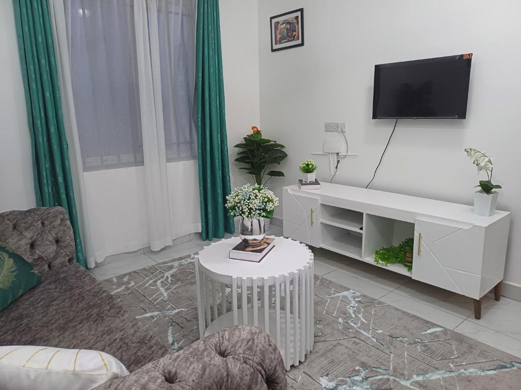 TV a/nebo společenská místnost v ubytování Havy Homes