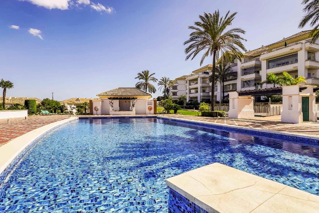 a large swimming pool in front of a building at 111 - Penthouse Apartment, La Cala in Mijas