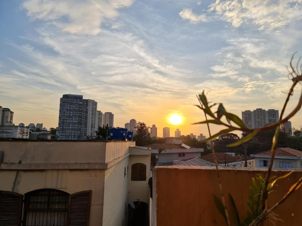 a sunset over a city skyline with buildings at Hostel On Top1 CGH SP Congonhas São Paulo in Sao Paulo