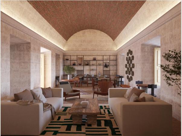 a living room with two couches and a table at Palacio Guaqui by Ananay Hotels in Arequipa