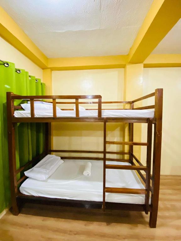 Postel nebo postele na pokoji v ubytování Hapitanan Siargao