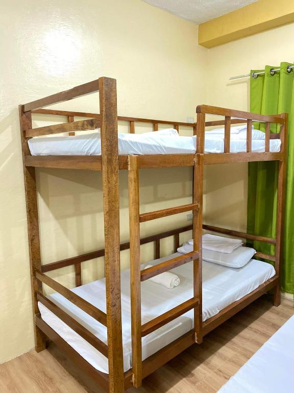 Postel nebo postele na pokoji v ubytování Hapitanan Siargao