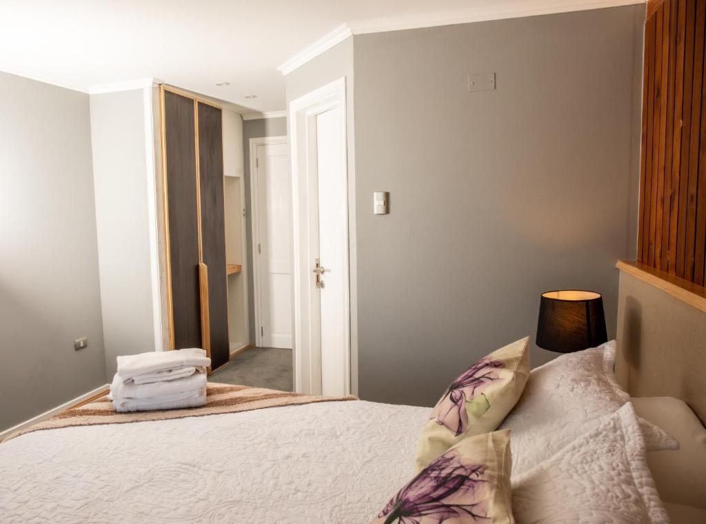 Postel nebo postele na pokoji v ubytování Hotel Hosteria Entre Lagos