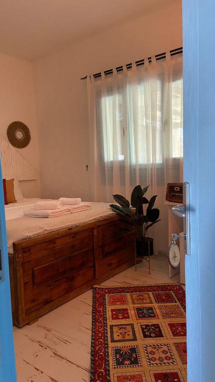 Postel nebo postele na pokoji v ubytování Sisu Alaçatı