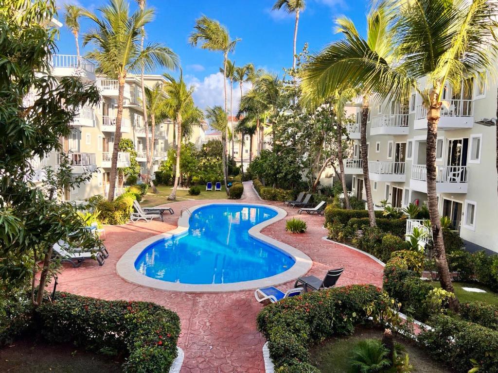 an image of a swimming pool at a resort at FIESTA SOL CARIBE playa LOS CORALES in Punta Cana