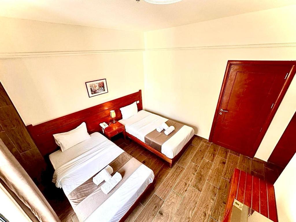 Postel nebo postele na pokoji v ubytování Caesar's Park Hotel