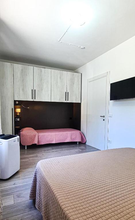 Łóżko lub łóżka w pokoju w obiekcie Vacanze a Colori