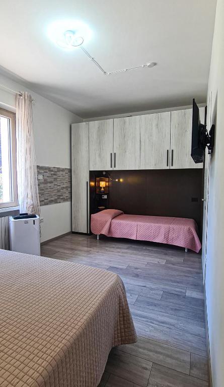 Łóżko lub łóżka w pokoju w obiekcie Vacanze a Colori