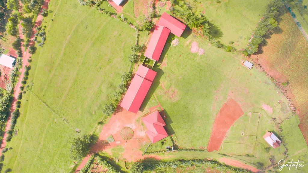 an overhead view of a house in a field at Lake bunyonyi view lodge in Kabale