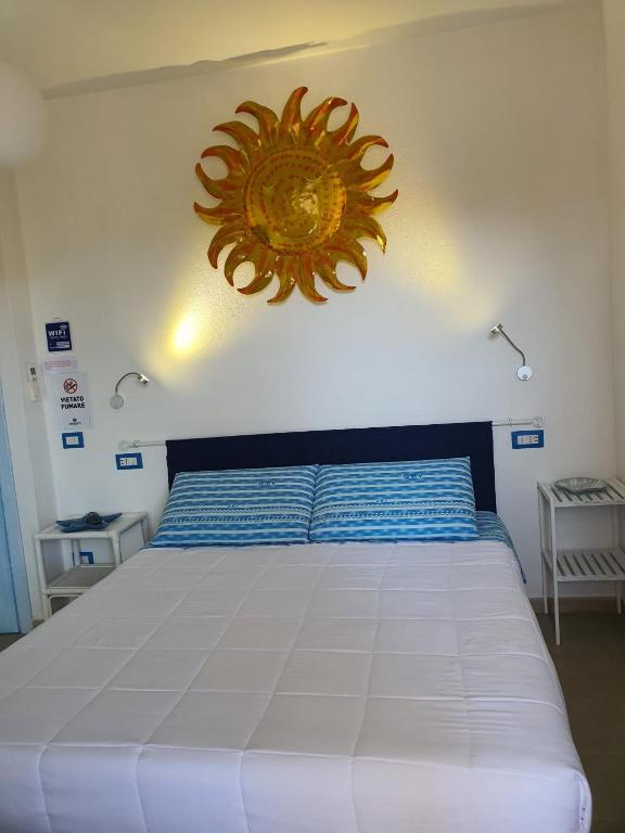 Postel nebo postele na pokoji v ubytování B&B da Nuccia Villasimius