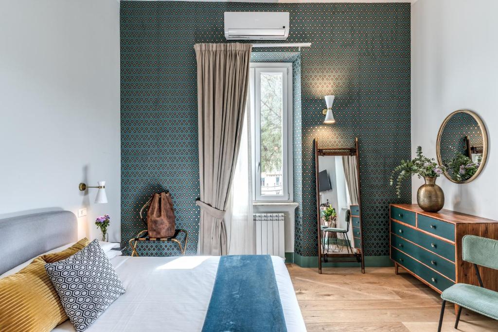 Postel nebo postele na pokoji v ubytování Tree Charme Trilussa