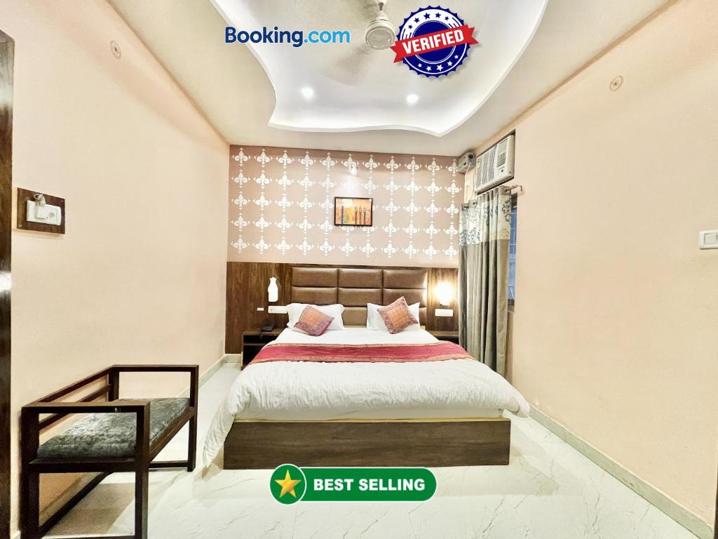 a bedroom with a bed and a sign that reads best selling at HOTEL NEEL GAGAN ! VARANASI fully-Air-Conditioned hotel at prime location, near Kashi Vishwanath Temple, and Ganga ghat in Varanasi