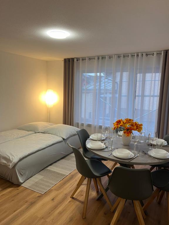 a bedroom with a bed and a table with chairs at Casa Estella in Rust