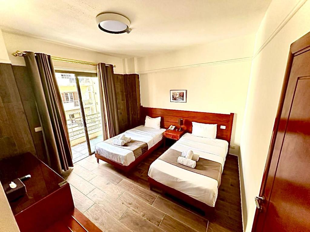 Postel nebo postele na pokoji v ubytování Caesar's Park Hotel