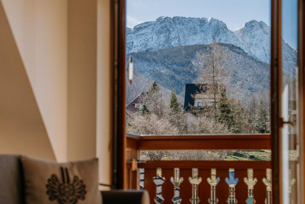 a view of a mountain from a window at Lipki Park Zakopane in Zakopane