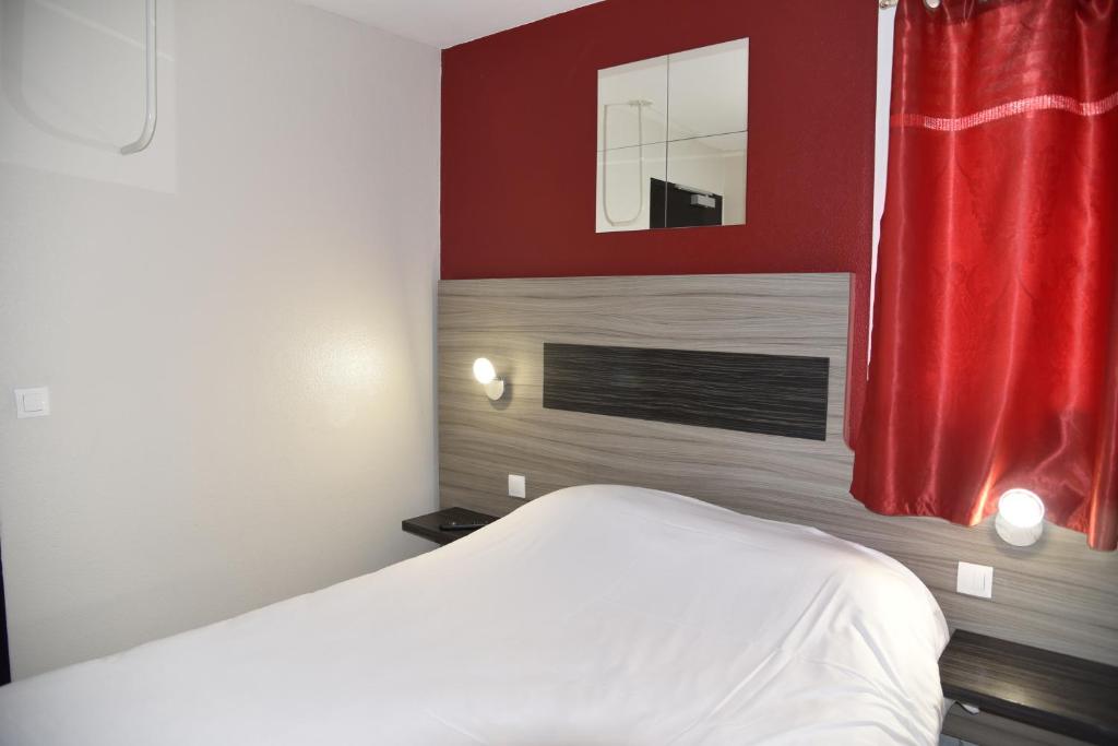 Postel nebo postele na pokoji v ubytování Hotel du Triangle