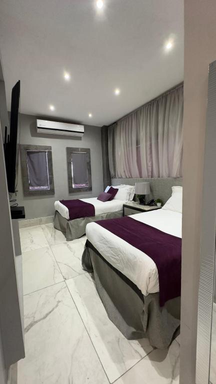 Postel nebo postele na pokoji v ubytování Gran Hotel Cantera La plaza