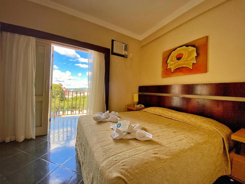 Uma cama ou camas num quarto em Hotel Zanon
