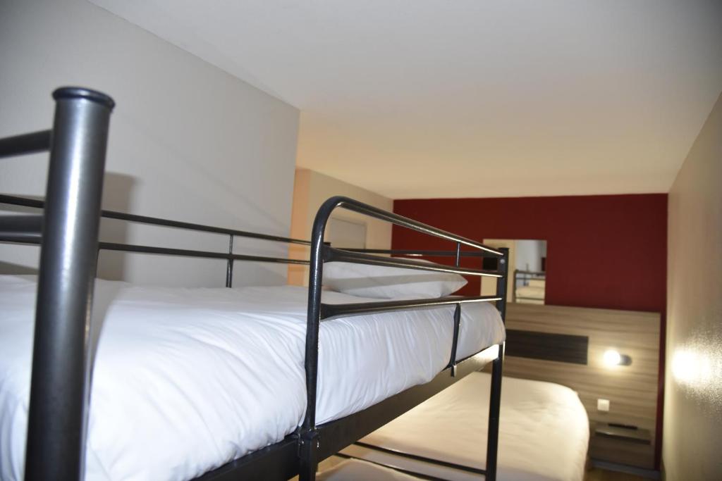 Postel nebo postele na pokoji v ubytování Hotel du Triangle