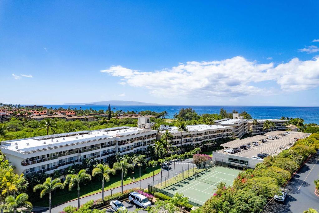 an aerial view of a building with a tennis court at Maui Banyan Vacation Club in Wailea