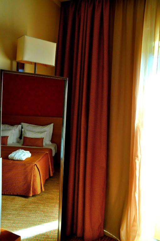 Uma cama ou camas num quarto em Hotel Lusitania Congress & Spa