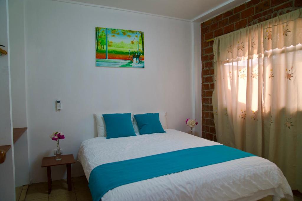 Postel nebo postele na pokoji v ubytování Suite Hotel Romanos