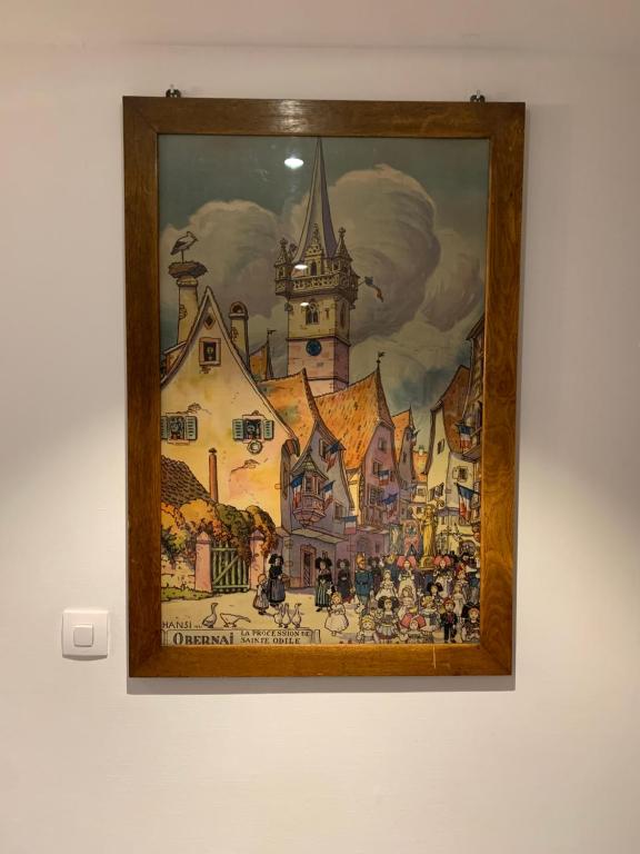 a painting of a castle on a wall at Appartement spacieux et lumineux in Sélestat