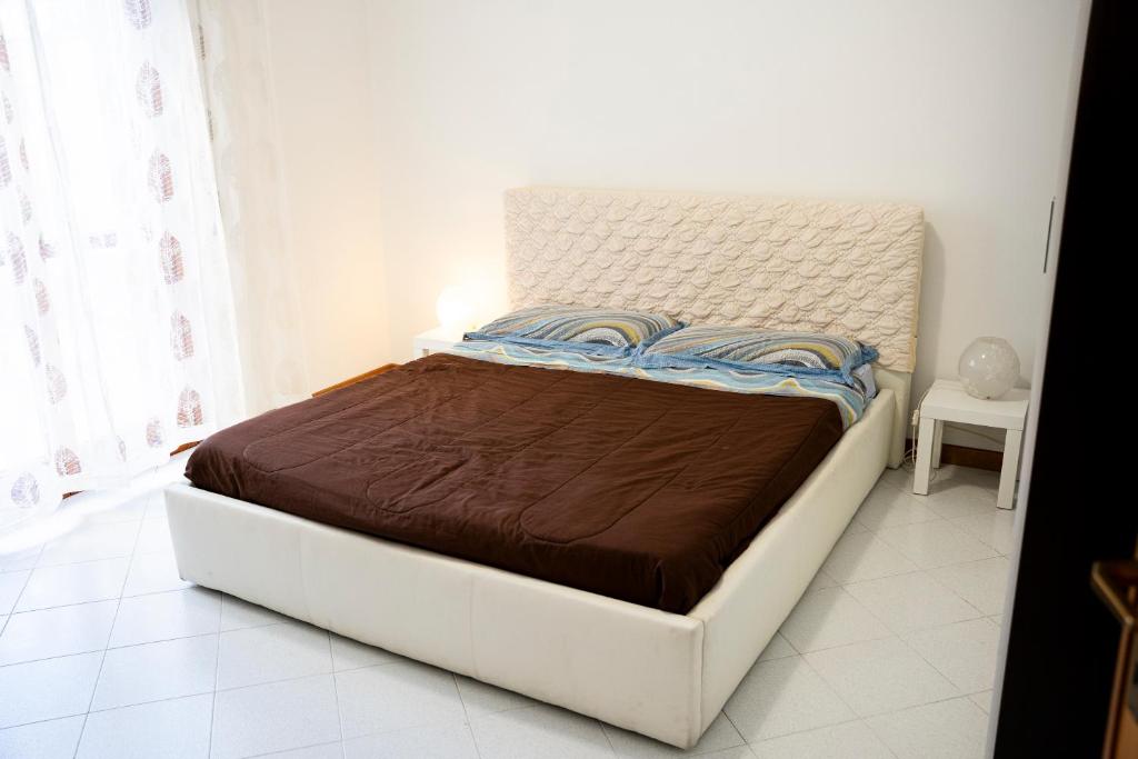 Postel nebo postele na pokoji v ubytování Appartamento Nettuno