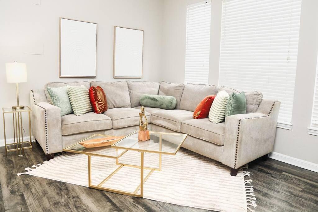 a living room with a couch and a table at Apartment in Houston Med Center in Houston