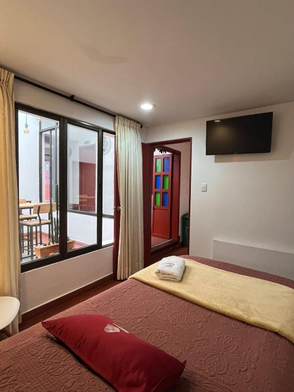 Voodi või voodid majutusasutuse Hostal Amanari toas