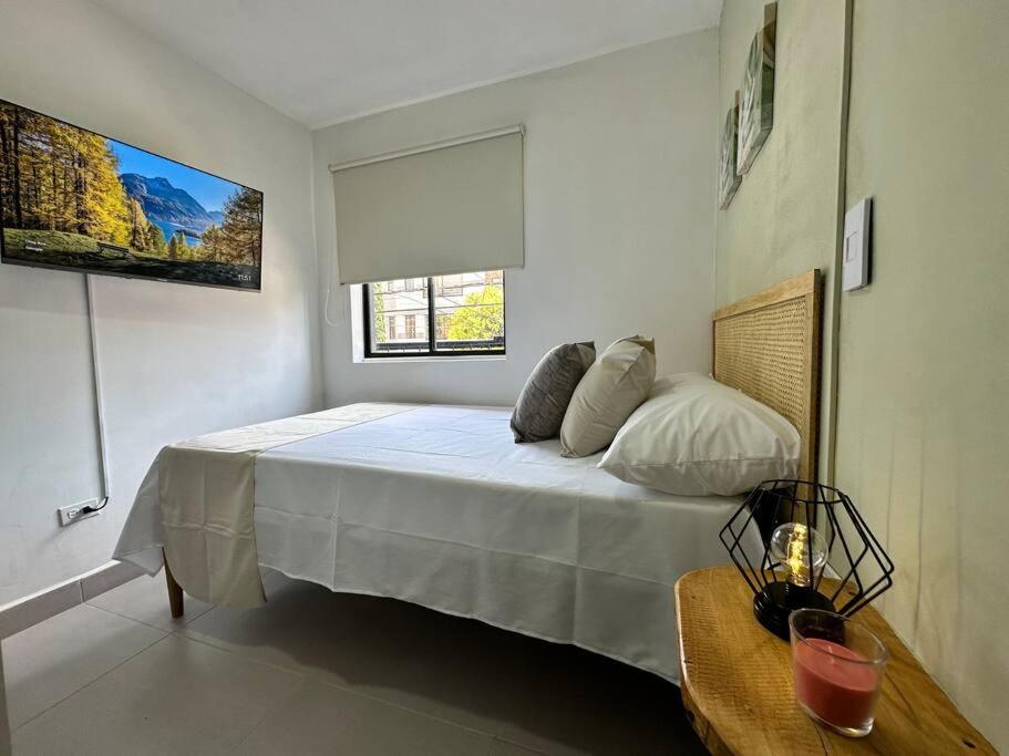 Llit o llits en una habitació de Hermoso apartamento con excelente ubicación