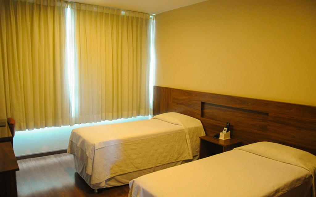 Кровать или кровати в номере Hotel Thermas Classic