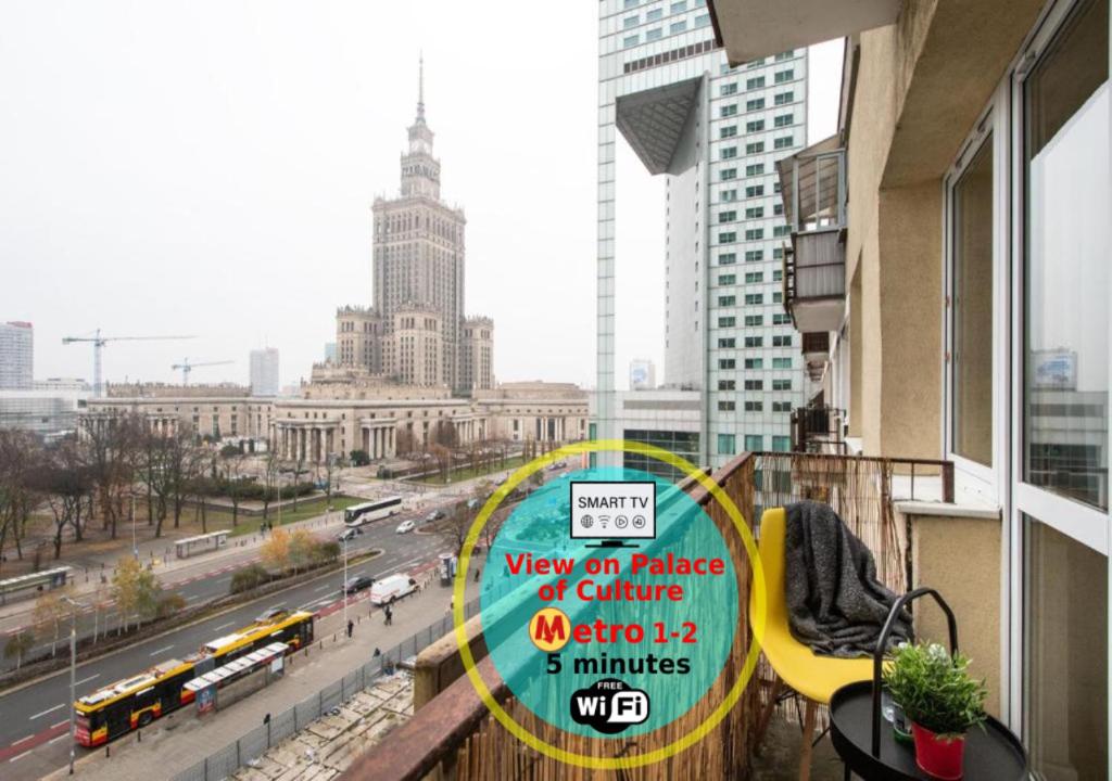 a sign on a balcony with a view of a city at Apartments Centre by Arrenda in Warsaw