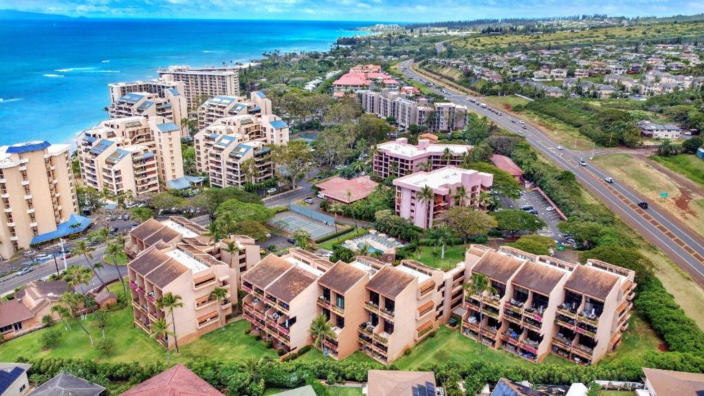 an aerial view of a city with buildings and the ocean at Kahana Villa in Lahaina