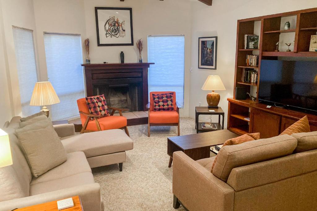 a living room filled with furniture and a tv at Rockridge in Sedona