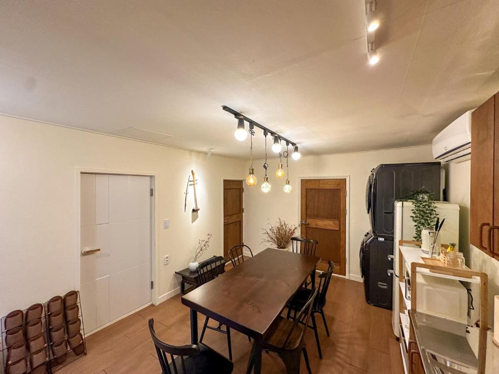 a kitchen and dining room with a table and chairs at Yunseul- Garden House in the City with Korean Beauty in Seoul