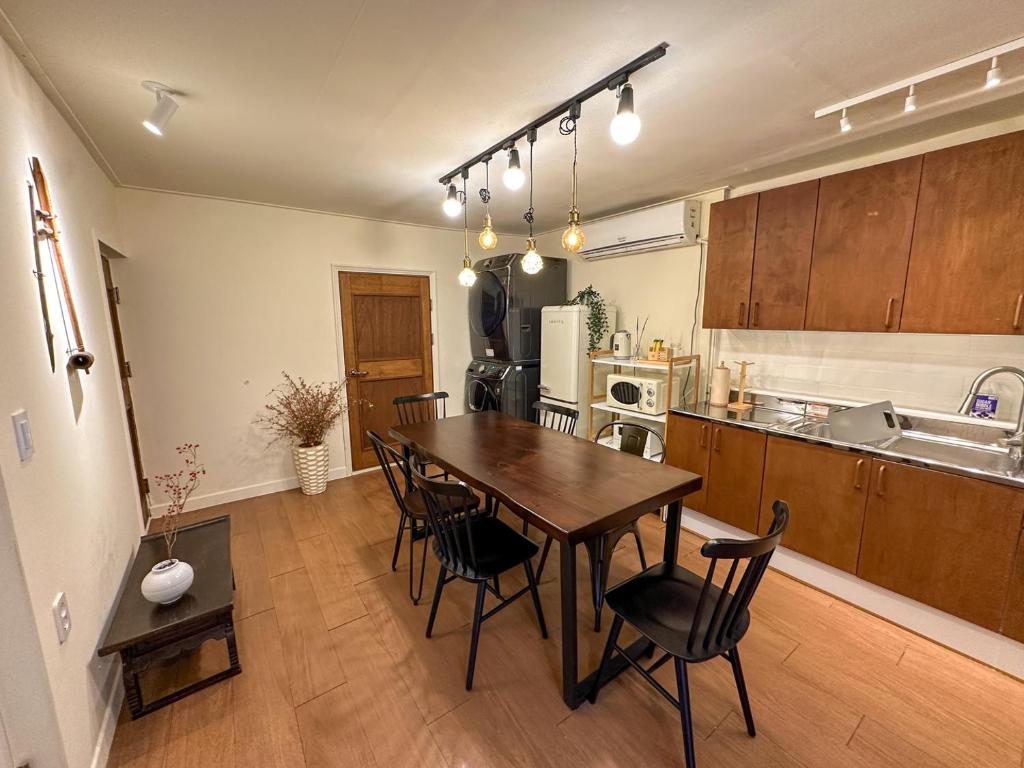 a kitchen and dining room with a table and chairs at Yunseul- Garden House in the City with Korean Beauty in Seoul